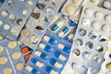Medicine, pills and tablets with blister packs turning.