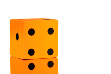 Orange dice on white background