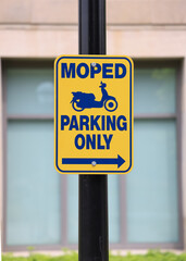 Road sign showing Moped parking direction.