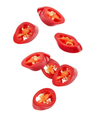 Falling sliced red hot chilli peppers isolated on white background, clipping path - obrazy, fototapety, plakaty