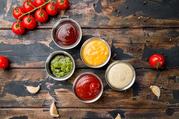 Foto op Canvas assorted sauces top view on old dark wooden table © Алиса Королевская