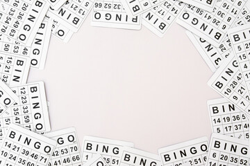 A lot of cards for a board game of bingo or lotto on a light background.
