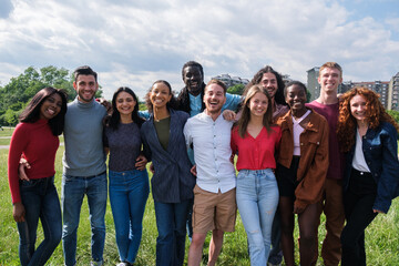 Group of young people from different cultures having a fun time in the park