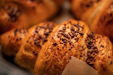 Homemade chocolate croissants with chocolate sprinkles baked in air fryer at home