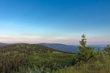 Vresnik, view from upper water reservoir of the pumped storage hydro power plant Dlouhe Strane in Jeseniky Mountains, Czech Republic.Summer sunset evening. 