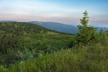 Vresnik, view from upper water reservoir of the pumped storage hydro power plant Dlouhe Strane in Jeseniky Mountains, Czech Republic. Summer sunset evening. 