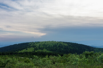 Fototapeta na wymiar Mravenecnik hill , view from upper water reservoir of the pumped storage hydro power plant Dlouhe Strane in Jeseniky Mountains, Czech Republic.