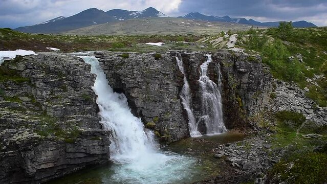 Waterfall in impressive Norwegian landscape, nature and travel scene