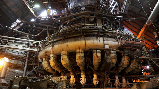 Close Up For The Blast Furnace With Liquid Steel Inside, Heavy Industry Concept. Machinery And Workers At The Metallurgical Plant.