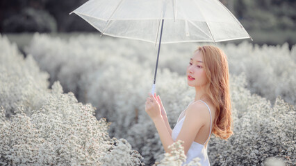 attractive cheerful asian woman holding yellow lemon, beauty and healthy skin care and cosmetic ideas concept