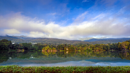 Ang Kaew lake landscape with mountains background in winter season at morning , Chiang mai , Thailand