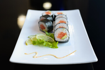 Japanese sushi on a white plate.