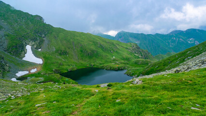 Capra Lake is glacier lake located in Fagaras Mountains near Transfagarasan mountains road. Carpathians. Romania.