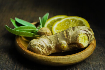 Ginger tea ingredients ginger lemon cinnamon clove saffron sage rustic close-up
