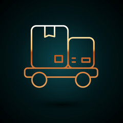 Gold line Hand truck and boxes icon isolated on dark blue background. Dolly symbol. Vector