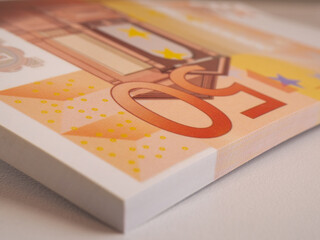 stacked several 50 euro bills