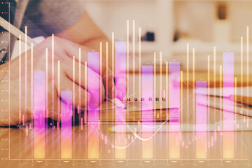 Multi exposure closeup hands with stock market forex graph.