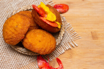 typical food from Bahia called acarajé surrounded by shrimps