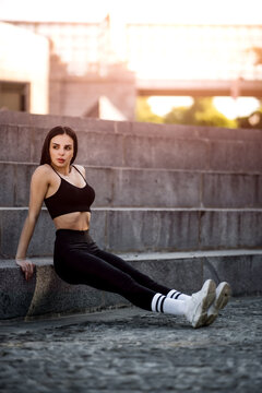 beautiful brunette working out on stairs
