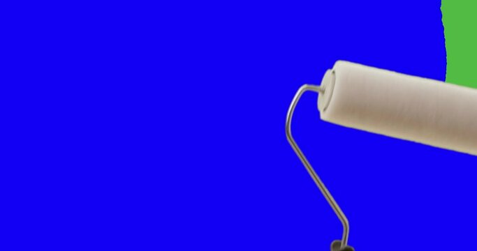 Female Hand Using Paint Roller To Cover Entire Screen From Green Screen to Blue Screen.