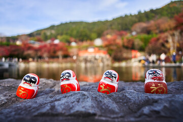 Naklejka premium Daruma (Dharma) Dolls and Katsuo-ji Temple in Japan in Autumn