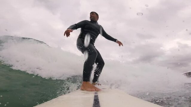 Goofy Surfer Riding Blue Wave getting good snap against the lip at slow motion mode, Sintra 2022