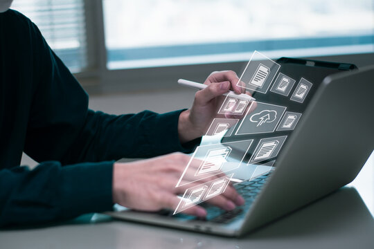 Businessman working on laptop computer,online electronic document information database,digital file cloud storage system or software, online compliance rules user management,business platform control