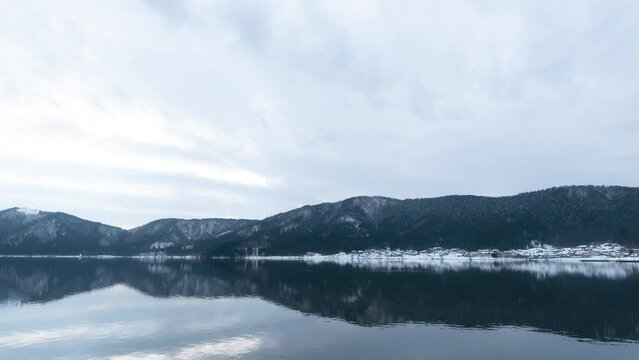 Time-lapse animation taken in midwinter, Nagahama Yogo Lake, Shiga Prefecture, snow-covered mountains and lake.