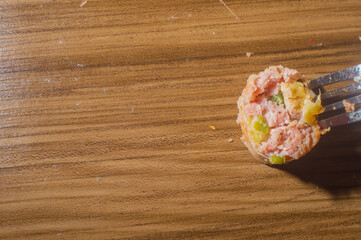 Sausage made with apple and jaalapeno pepper, on a wooden tablet with apples in the pictureand copy space