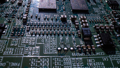 Electronic circuit board technology background. Electronic plate pattern. Circuit board, electrical scheme. Technology background. Electronic microcircuit with microchips and capacitors taken.