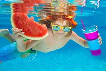 Summer kids portrait in pool water. Child boy swim under water in sea. Kid swimming in pool underwater. Happy boy swims in sea underwater, active kid swimming, playing and diving. © Volodymyr