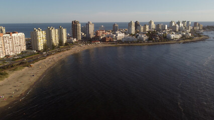 Punta del Este beach with waterfront buildings at sunrise, Uruguay. Aerial