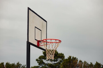 Basketball hoop used for recreation on a cloudy day