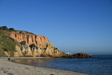 Northern view of the sandstone cliffs known as Red Bluff, with obscured pier in the background