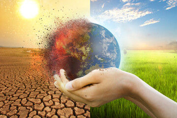 Hand of young man hold world globe with burn hot by drought environment and beautiful green...