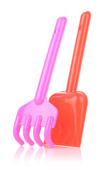 A set of children's toys for playing in the sandbox. Colored rake and shovel made of plastic, isolated on a white background, close-up. Early child development, children's leisure concept