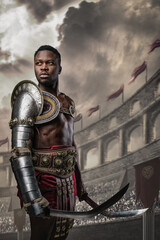 Portrait of handsome gladiator of african ethnic dressed in light armor holding twin swords.