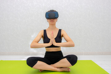Fototapeta na wymiar Meditation with vr glasses at home, sports with VR glasses