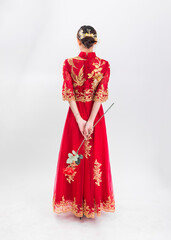 A woman in a red Traditional Chinese wedding dress