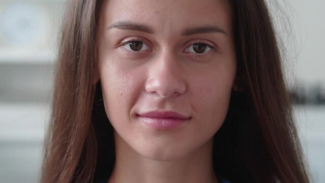 close up portrait of attractive woman smiling brunette confident pretty ooking at camera