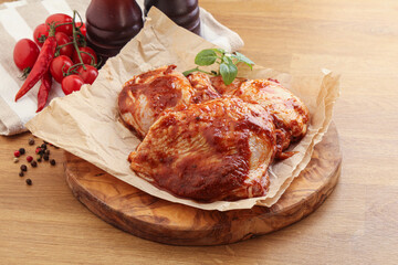 Marinated chicken leg in tomato sauce