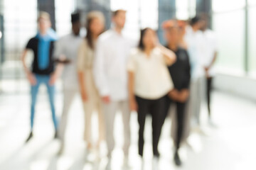 Blurred image of business people standing in the office