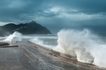 Obraz premium Waves breaking on New Promenade of Donostia-San Sebastian, Spain
