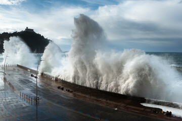 Fototapeta premium Waves breaking on New Promenade of Donostia-San Sebastian, Spain