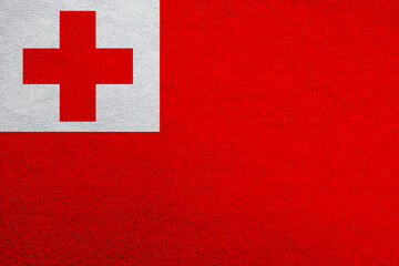 Modern shine leather background in colors of national flag. Tonga