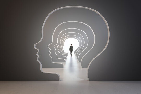 Abstract image of man walking through head outline corridor. Thinking, maze, solution and answer search concept.