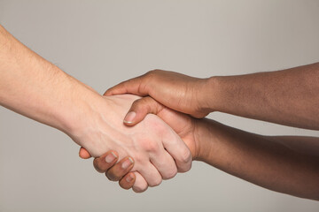 handshake of a white and black man