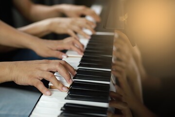 Fototapeta na wymiar Piano Keyboard side corner and Hands of lover playing music.