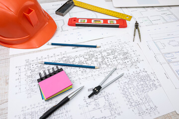 Architectural project construction of the house with helmet, compass, pencil, rural and calculator