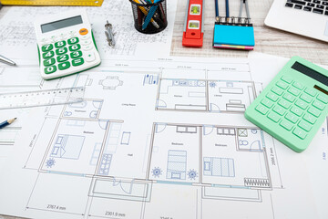 designers work as a team on drawings and designs of new house projects.